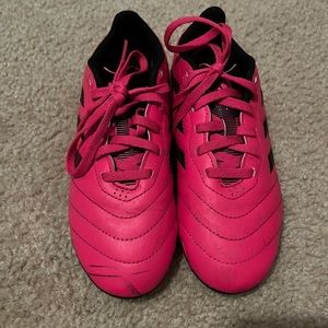Pink soccer shoes